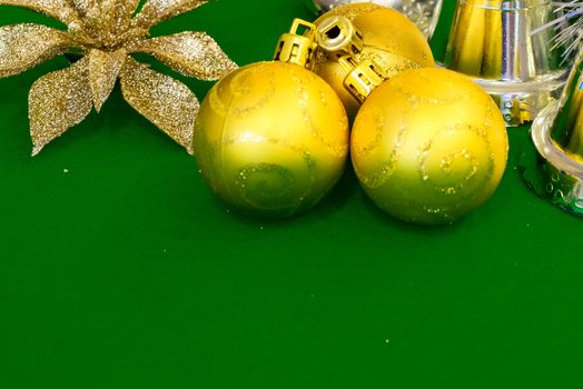 Christmas decoration silver or gold on green tablecloth or cloth