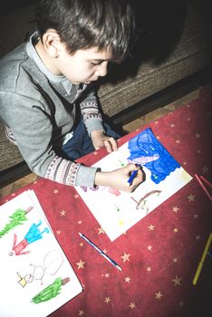 Child painting. Direct on camera flash