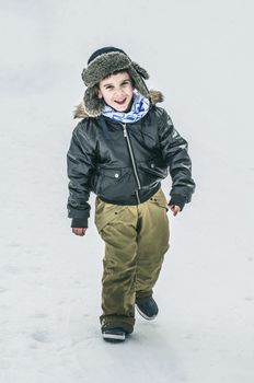 Child playing on the snow