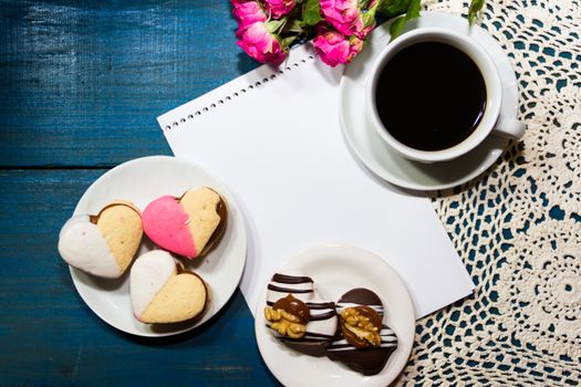 cup of coffee with flowers and note with place for text