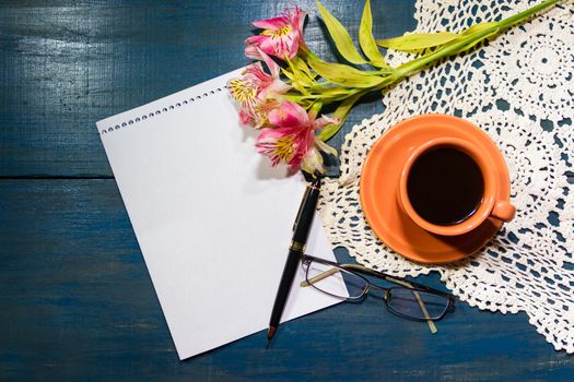 cup of coffee with flowers and note with place for text