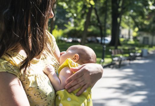 Women and baby in a park. Sunny day