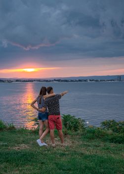 Nessebar, Bulgaria – 07.09.2019. Romantic couple admires the sunset in Nessebar, Bulgaria