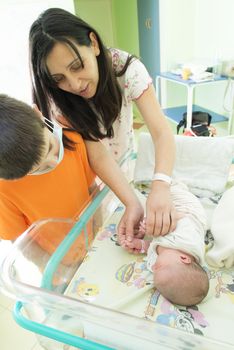 Newborn baby in a hospital. Baby room