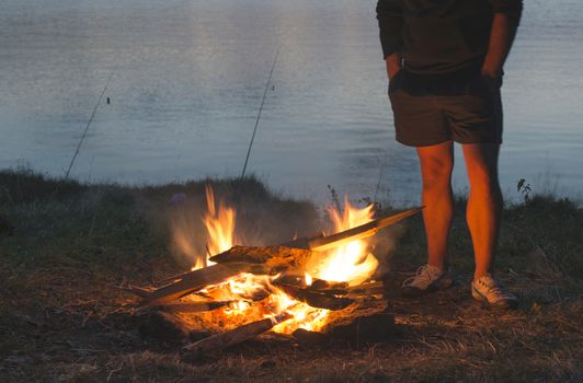 Fire in the nature. Preparing barbecue in the forest