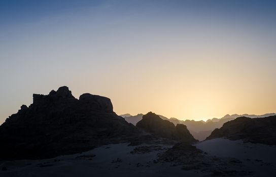 peaks of mountains in the desert of egypt against sunset