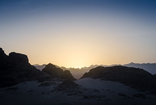 peaks of mountains in the desert of egypt against sunset