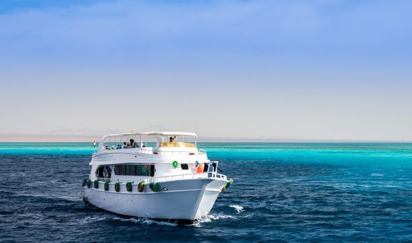 large white pleasure boat in the blue water of the Red Sea Sharm El Sheikh Egypt