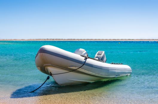big boat with a motor tied at the seashore in Egypt