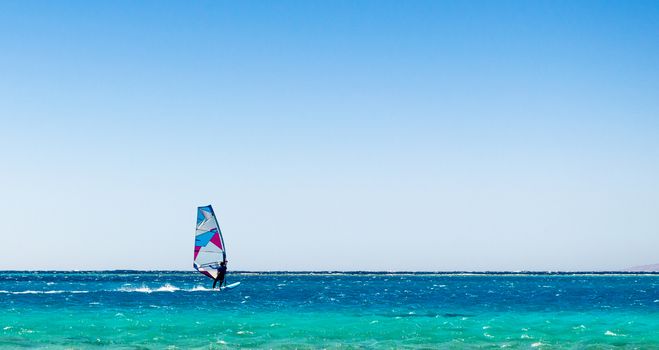 surfer rides in the Red Sea in Egyp