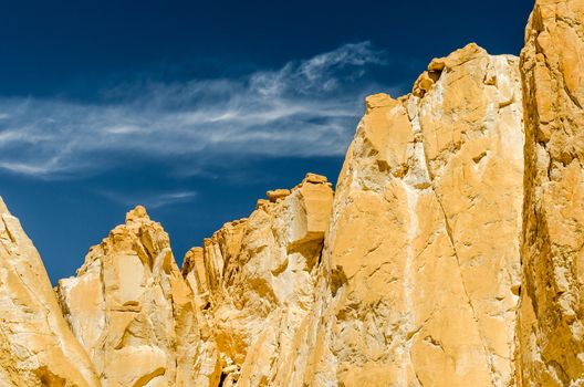 high rocky mountains against the blue sky and white clouds in the desert in Egypt Dahab South Sinai