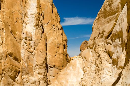 high rocky mountains against the blue sky and white clouds in the desert in Egypt Dahab South Sinai