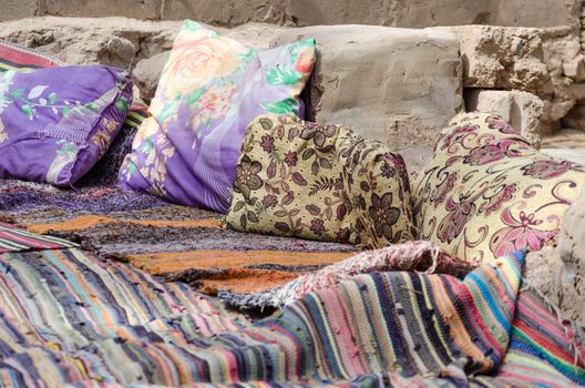 colored carpets and pillows in a Bedouin village in Egypt Dahab