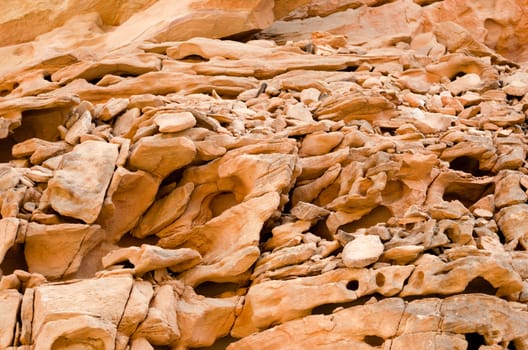 texture of orange stone rock in a colored canyon closeup