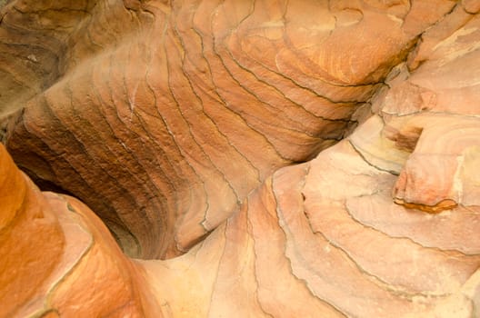texture of orange stone rock in a colored canyon closeup