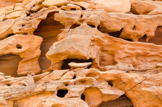 texture of orange stone rock in a colored canyon closeup