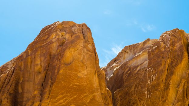 high rocky mountains against the blue sky and white clouds in the desert in Egypt Dahab South Sinai