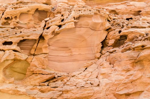 texture of orange stone rock in a colored canyon closeup