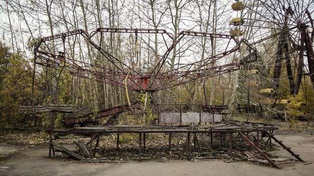 ruins of the carousel in an abandoned amusement park in Chernobyl