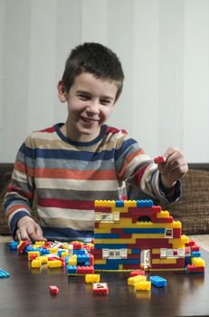 Child play with children's plastic constructor toys