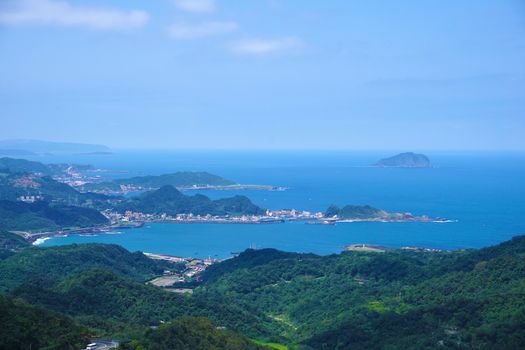 Aerial View of Jiufen in Taiwan with mountain, sea, sky and village