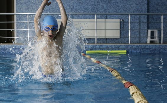 Boy jump in swimming pool