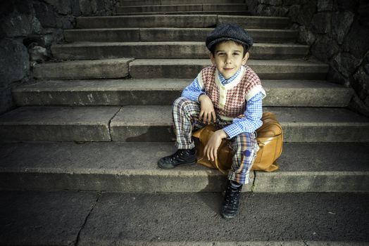 Exterior stairs and child with vintage bag. Vintage clothes style