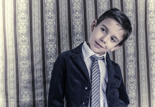 Boy in vintage black suit and tie