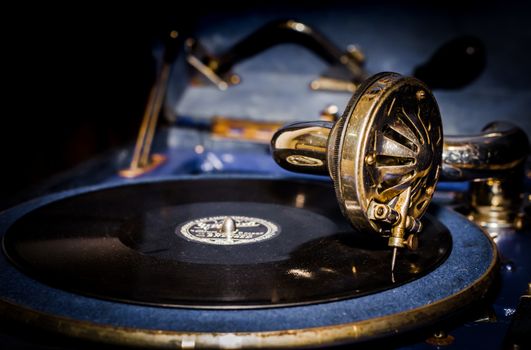 old blue gramophone with vinyl record