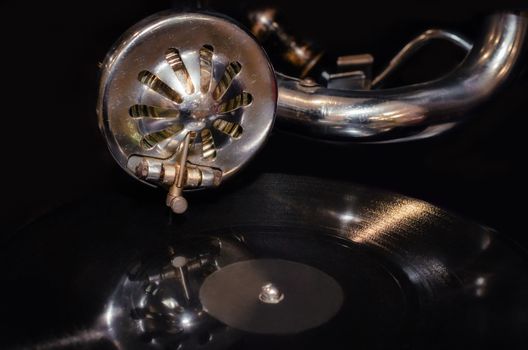 vinyl record and fragment of vintage gramophone closeup