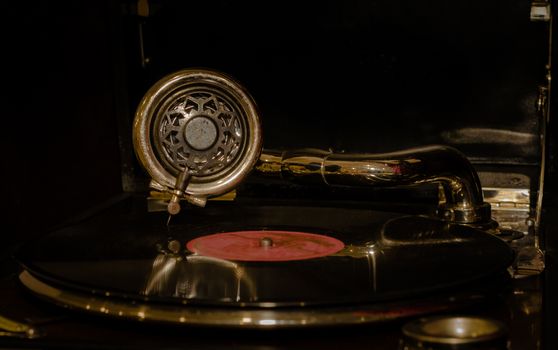 fragment of an old gramophone with a vinyl record