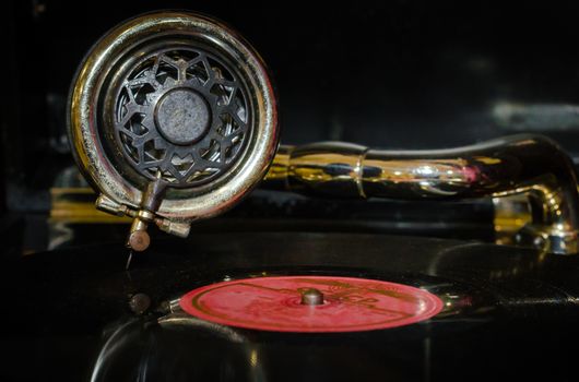 fragment of an old gramophone with a vinyl record