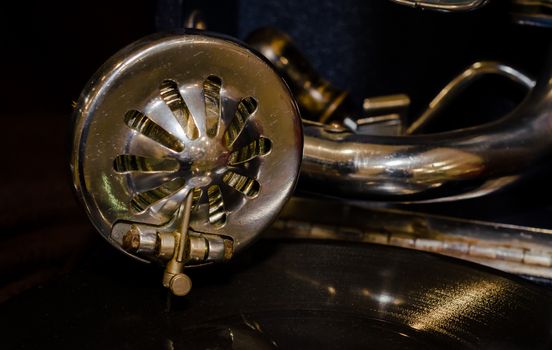 fragment of an old gramophone with a vinyl record