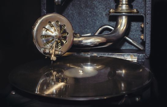 vinyl record and fragment of vintage gramophone closeup