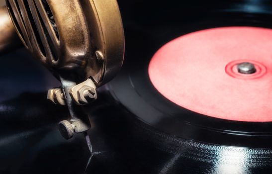 vinyl record and fragment of vintage gramophone closeup