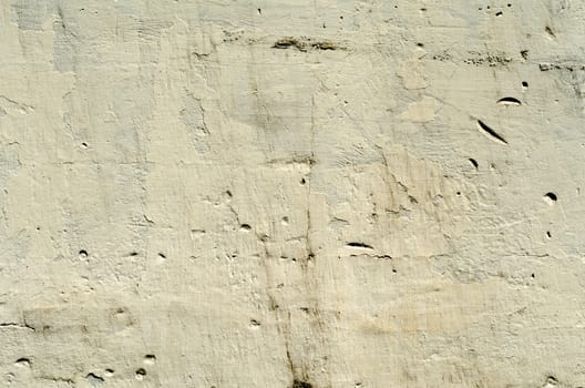 brown texture old concrete wall with remains of paint with damages