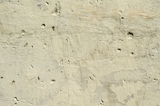 brown texture old concrete wall with remains of paint with damages