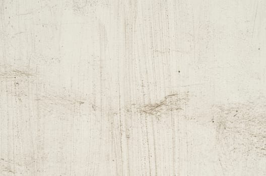 beige texture old concrete wall with remnants of plaster