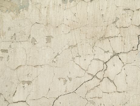 white texture old concrete wall with remains of plaster with cracks