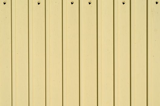 yellow texture metal profiled surface with bolts