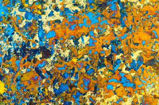 motley abstraction texture layers multicolored oil paint on rusty metal surface blue orange yellow
