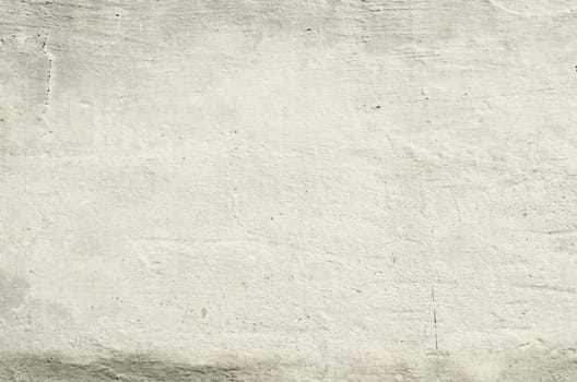 white texture old concrete wall with remains of plaster with cracks