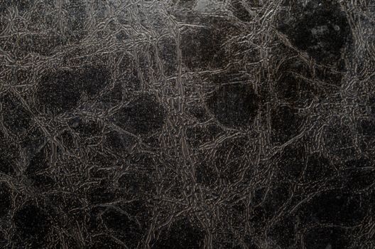 texture of old black leather macro closeup