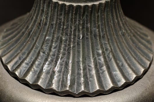 fragment of old metal candlestick macro closeup