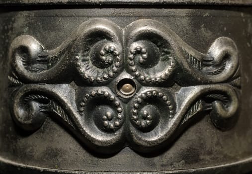 fragment of old metal candlestick macro closeup