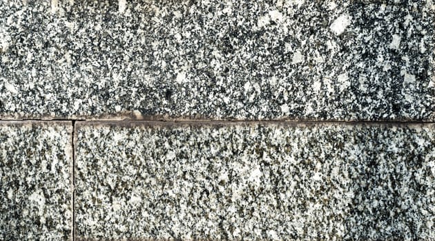 texture of old granite tiles on the wall