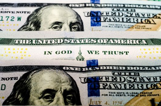 bill hundred US dollars closeup phrase in god we trust