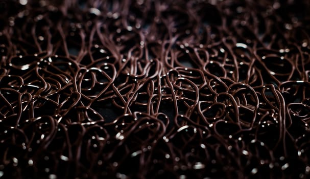 texture pattern of dark brown rubber on a black background