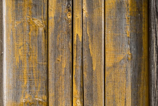 texture wooden boards with traces of yellow paint