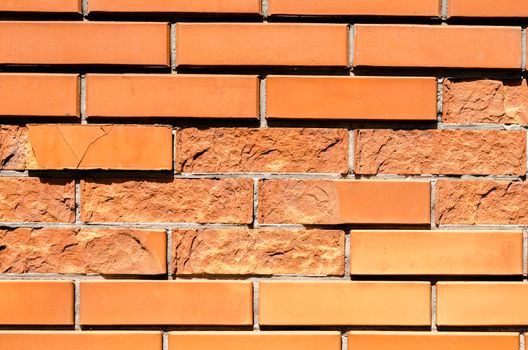 texture orange brick wall with damaged fragments